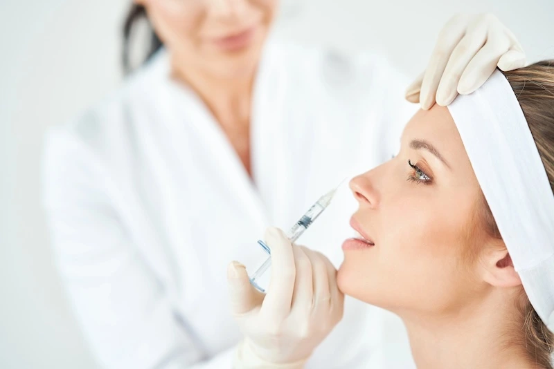 Patient receiving injected treatment on the face