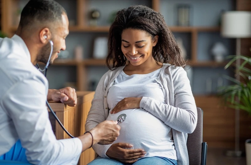 Pregnant woman receiving check up